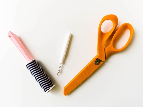 Lint roller, seam ripper, and scissors